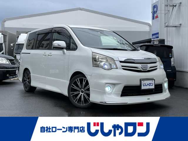 トヨタ ノア Si 福岡県 2011(平23)年 5.9万km ホワイトパールクリスタルシャイン モデリスタエアロ/社外足回り/両側パワースライドドア/純正HDDナビ・フルセグTV/　　CD/DVD/Buletooth/バックカメラ/社外１８インチアルミホイール/パドルシフト/プッシュスタート＆スマートキー/ビルトインETC/新車時保証書＆取扱説明書/スペアスマートキー