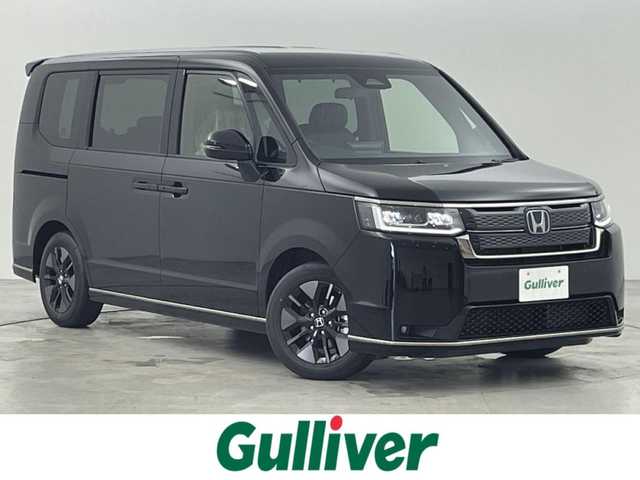 ホンダ ステップワゴン スパーダ eHEV 福岡県 2025(令7)年 0.1万km未満 クリスタルブラックパール 登録済未使用車　/純正９型ナビ　/フルセグTV/バックカメラ　/アダプティブククルコン　/コーナーセンサー　/衝突被害軽減ブレーキ　/レーンキープ　/ＢＳＭ　/パドルシフト/両側電動スライドドア　/ハーフレザーシート　/シートヒーター　/パワーバックドア