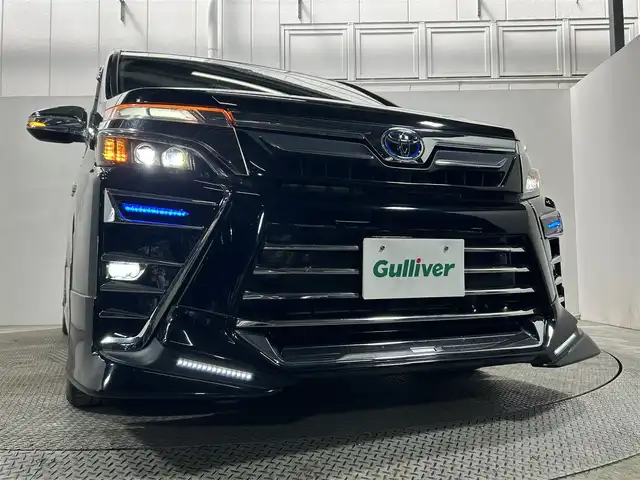 トヨタ ヴォクシー ハイブリッド ZS 煌Ⅲ 大阪府 2021(令3)年 3.5万km ブラック TRDエアロ LOXARNY18incAW 純正ナビTV フリップダウンモニター ハーフレザー シートヒーター クルーズコントロール 衝突軽減ブレーキ レーンアシスト オートハイビーム 両側パワースライドドア クリアランスソナー