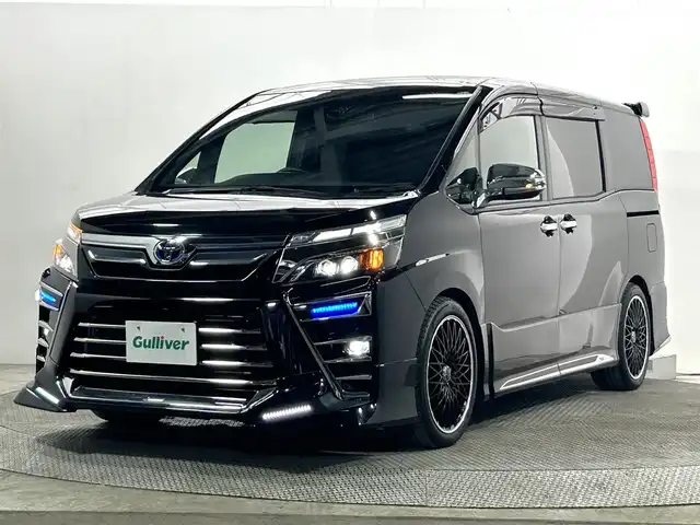 トヨタ ヴォクシー ハイブリッド ZS 煌Ⅲ 大阪府 2021(令3)年 3.5万km ブラック TRDエアロ LOXARNY18incAW 純正ナビTV フリップダウンモニター ハーフレザー シートヒーター クルーズコントロール 衝突軽減ブレーキ レーンアシスト オートハイビーム 両側パワースライドドア クリアランスソナー
