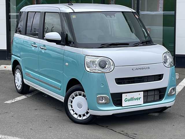 ダイハツ ムーヴ キャンバス ストライプス G 道東・釧路十勝 2023(令5)年 0.8万km シャイニングホワイトパール/ファインミントメタリック ・４WD/・社外メモリナビ(ラジオ BT)/・バックカメラ/・両側パワースライドドア/・衝突被害軽減ブレーキ/・横滑り防止装置/・ETC/・前席シートヒーター/・コーナーセンサー/・LEDヘッドライト/・LEDフォグランプ/・スマートキー/・プッシュスタート/・ステアリングリモコン/・電動格納ミラー/・アイドリングストップ/・純正フロアマット