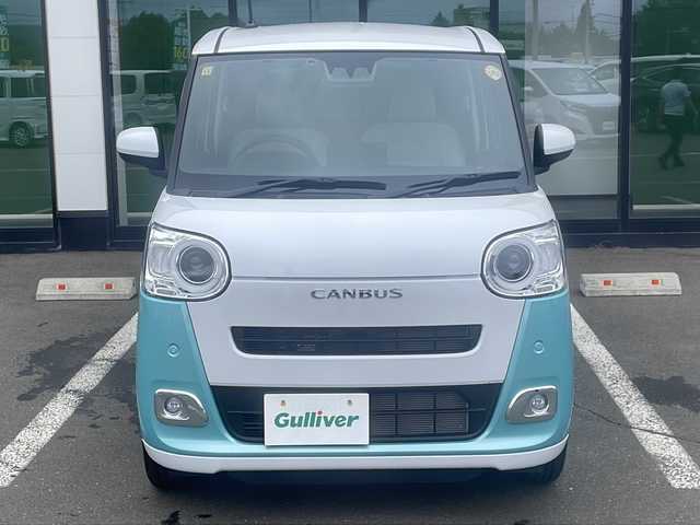 ダイハツ ムーヴ キャンバス ストライプス G 道東・釧路十勝 2023(令5)年 0.8万km シャイニングホワイトパール/ファインミントメタリック ・４WD/・社外メモリナビ(ラジオ BT)/・バックカメラ/・両側パワースライドドア/・衝突被害軽減ブレーキ/・横滑り防止装置/・ETC/・前席シートヒーター/・コーナーセンサー/・LEDヘッドライト/・LEDフォグランプ/・スマートキー/・プッシュスタート/・ステアリングリモコン/・電動格納ミラー/・アイドリングストップ/・純正フロアマット