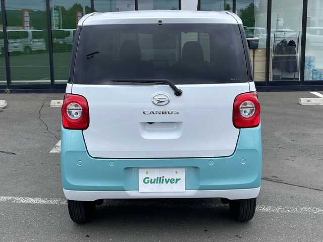 ダイハツ ムーヴ キャンバス ストライプス G 道東・釧路十勝 2023(令5)年 0.8万km シャイニングホワイトパール/ファインミントメタリック ・４WD/・社外メモリナビ(ラジオ BT)/・バックカメラ/・両側パワースライドドア/・衝突被害軽減ブレーキ/・横滑り防止装置/・ETC/・前席シートヒーター/・コーナーセンサー/・LEDヘッドライト/・LEDフォグランプ/・スマートキー/・プッシュスタート/・ステアリングリモコン/・電動格納ミラー/・アイドリングストップ/・純正フロアマット