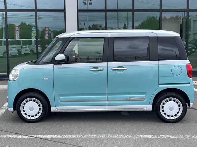 ダイハツ ムーヴ キャンバス ストライプス G 道東・釧路十勝 2023(令5)年 0.8万km シャイニングホワイトパール/ファインミントメタリック ・４WD/・社外メモリナビ(ラジオ BT)/・バックカメラ/・両側パワースライドドア/・衝突被害軽減ブレーキ/・横滑り防止装置/・ETC/・前席シートヒーター/・コーナーセンサー/・LEDヘッドライト/・LEDフォグランプ/・スマートキー/・プッシュスタート/・ステアリングリモコン/・電動格納ミラー/・アイドリングストップ/・純正フロアマット