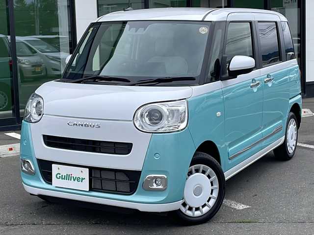 ダイハツ ムーヴ キャンバス ストライプス G 道東・釧路十勝 2023(令5)年 0.8万km シャイニングホワイトパール/ファインミントメタリック ・４WD/・社外メモリナビ(ラジオ BT)/・バックカメラ/・両側パワースライドドア/・衝突被害軽減ブレーキ/・横滑り防止装置/・ETC/・前席シートヒーター/・コーナーセンサー/・LEDヘッドライト/・LEDフォグランプ/・スマートキー/・プッシュスタート/・ステアリングリモコン/・電動格納ミラー/・アイドリングストップ/・純正フロアマット