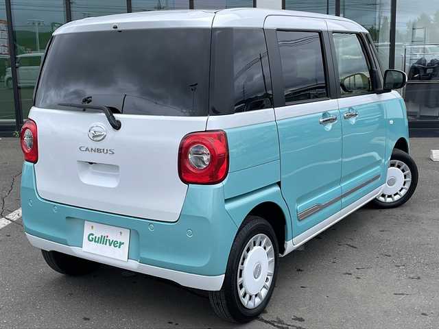 ダイハツ ムーヴ キャンバス ストライプス G 道東・釧路十勝 2023(令5)年 0.8万km シャイニングホワイトパール/ファインミントメタリック ・４WD/・社外メモリナビ(ラジオ BT)/・バックカメラ/・両側パワースライドドア/・衝突被害軽減ブレーキ/・横滑り防止装置/・ETC/・前席シートヒーター/・コーナーセンサー/・LEDヘッドライト/・LEDフォグランプ/・スマートキー/・プッシュスタート/・ステアリングリモコン/・電動格納ミラー/・アイドリングストップ/・純正フロアマット