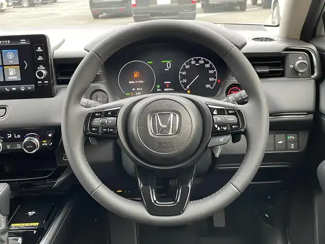 ホンダ ヴェゼル ハイブリッド e:HEV Z 東京都 2025(令7)年 0.1万km未満 プラチナホワイトパール 登録済未使用車/純正コネクトナビ/バックモニター/衝突被害軽減/路外逸脱抑制/アダプティブクルーズコントロール/ソナー/ＥＴＣ/シートヒーター/ステアリングスイッチ/横滑り防止措置/スマートキー