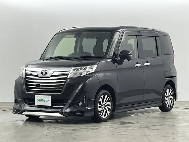 トヨタ ルーミー カスタムG S 福島県 2018(平30)年 2.1万km ブラックマイカメタリック スマートアシスト/・衝突回避支援ブレーキ機能/・車線逸脱警報機能/・アダプティブクルーズコントロール/・オートハイビーム/・アダプティブドライビングビーム/モデリスタエアロ/・フロント/サイド/リアスポイラー/社外HDDナビ/型番:AVIC-RL801/・AM/FM/CD/DVD/BT/SD/フルセグTV/・バックカメラ/・ETC/両側パワースライドドア/ステアリングスイッチ/・チルト式ステアリング/LEDヘッドライト/・オートライト/プッシュスタート/・スマートキー/純正AW/純正フロアマット
