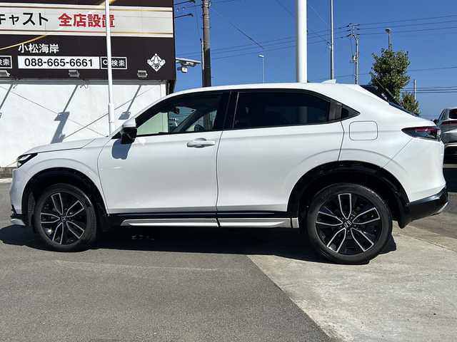 ホンダ ヴェゼル ハイブリッド e:HEV Z 徳島県 2021(令3)年 7.1万km プラチナホワイトパール 純正ナビ/（BT/フルセグ/USB/ラジオ）/バックカメラ/ETC2.0/ブラインドスポットモニター/クリアランスソナー/ワイパーデザイアー/ミラーヒーター/純正18インチアルミホイール/LEDヘッドライト/ハーフレザーシート/D/N席シートヒーター/ステアリングヒーター/追従式クルーズコントロール/電動リアゲート/前後ドライブレコーダー/純正フロアマット/寒冷地仕様/スマートキー/置くだけ充電/取扱説明書/新車時保証書