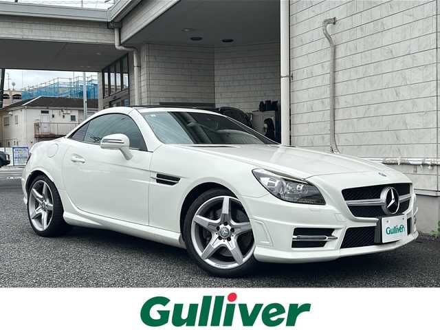 メルセデス・ベンツ ＳＬＫ２００ MT AMG スポーツPKG 神奈川県 2013(平25)年 3.9万km カルサイトホワイト AMGスポーツパッケージ/オープンカー/本革シート/OP純正１８インチAW/純正ナビ（AM/FM/SD/USB/BT/ワンセグTV)/クルーズコントロール（スピードリミッター）/ETC/シートヒーター/ネックヒーター/アテンションアシスト/電子パーキングブレーキ/純正フロアマット/HIDヘッドライト/ベンツブレーキキャリパー/保証書/取扱説明書