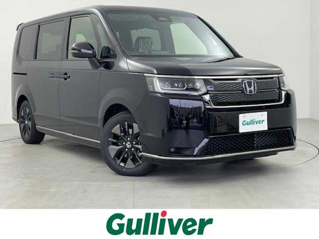 ホンダ ステップワゴン スパーダ eHEV 千葉県 2025(令7)年 0.1万km未満 クリスタルブラックパール 登録済未使用車/ホンダセンシング/●衝突軽減ブレーキ（CMBS）/●誤発進抑制機能/●後方誤発進抑制機能/●近距離衝突軽減ブレーキ/●歩行者事故低減ステアリング/●路外逸脱抑制機能/●渋滞追従機能付アダプティブクルーズコントロール（ACC）/●車線維持支援システム（LKAS）/●トラフィックジャムアシスト（渋滞運転支援機能）/●先行車発進お知らせ機能/●標識認識機能/●オートハイビーム/●アダプティブドライビングビーム/両側パワースライドドア/パワーバックドア/純正11.4インチナビ(LXM-247VFLi)/CD/DVD/USB/Bluetooth/フルセグTV/バックカメラ/ブラインドスポットインフォメーション/シートヒーター/パドルシフト/電動パーキング/オートブレーキホールド/２列目オットマン/純正16インチアルミホイール/ファブリック＆プライムスムースコンビシート/スペアキー