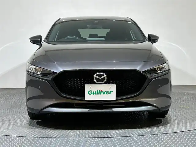 マツダ マツダ３ファストバック 15S ツーリング 愛媛県 2022(令4)年 4.5万km マシーングレープレミアムM ・８．８型ナビ/（フルセグＴＶ・ＢＴ・ＤＶＤ・ＦＭ・ＡＭ・ａｐｐｌｅ　ｃａｒｐｌａｙ・ａｎｄｒｏｉｄ　ａｕｔｏ）/・全方位カメラ　/・ＥＴＣ　/・レーダークルーズコントロール　/・衝突軽減ブレーキ　/・レーンキープ/・前後コーナーセンサー