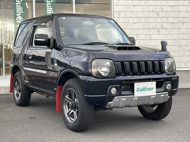 スズキ ジムニー クロスアドベンチャー 青森県 2014(平26)年 4.5万km ブルーイッシュブラックパール3 ・4WD/・黒×赤レザーシート/・社外SDナビ/　　（ワンセグTV/CD/SD)/・マッドフラップ/・バックカメラ/・フォグライト/・ウィンカーミラー/・純正マフラー積込/・純正フロントグリル積込/・運転席シートヒーター/・前後ドライブレコーダー/・背面タイヤ（ハードカバー）/・キーレスエントリー/・ETC/・ドアバイザー