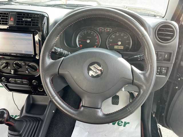 スズキ ジムニー クロスアドベンチャー 青森県 2014(平26)年 4.5万km ブルーイッシュブラックパール3 ・4WD/・黒×赤レザーシート/・社外SDナビ/　　（ワンセグTV/CD/SD)/・マッドフラップ/・バックカメラ/・フォグライト/・ウィンカーミラー/・純正マフラー積込/・純正フロントグリル積込/・運転席シートヒーター/・前後ドライブレコーダー/・背面タイヤ（ハードカバー）/・キーレスエントリー/・ETC/・ドアバイザー