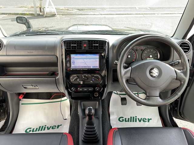 スズキ ジムニー クロスアドベンチャー 青森県 2014(平26)年 4.5万km ブルーイッシュブラックパール3 ・4WD/・黒×赤レザーシート/・社外SDナビ/　　（ワンセグTV/CD/SD)/・マッドフラップ/・バックカメラ/・フォグライト/・ウィンカーミラー/・純正マフラー積込/・純正フロントグリル積込/・運転席シートヒーター/・前後ドライブレコーダー/・背面タイヤ（ハードカバー）/・キーレスエントリー/・ETC/・ドアバイザー