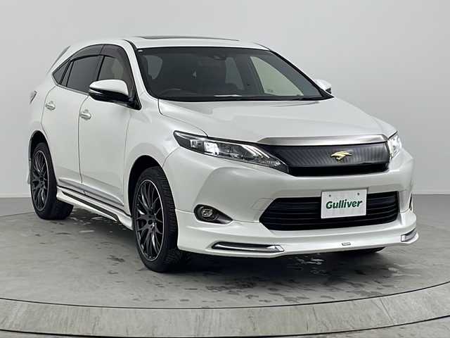 トヨタ ハリアー プレミアム 熊本県 2017(平29)年 5.7万km ホワイトパールクリスタルシャイン 純正ナビ/（フルセグ/CD/DVD/Bluetooth）/モデリスタエアロ/サンルーフ/パワーバックドア/クルーズコントロール/ETC/社外20インチアルミホイール/ステアリングスイッチ/スマートキー・プッシュスタート