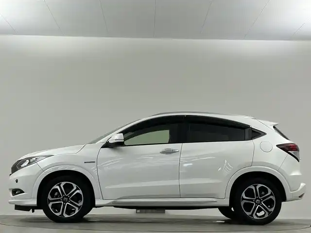 ホンダ ヴェゼル ハイブリッド Z ホンダセンシング 埼玉県 2016(平28)年 6.9万km ホワイトオーキッドパール 純正ナビ　温ヒーター　ＥＴＣ　Ｂカメラ　ＬＥＤヘッドライト　ハーフレザーシート　フルセグＴＶ　オートハイビーム　レーンキープ　衝突被害軽減　ＭＴモード付ＡＴ アダプティブクルーズコントロール