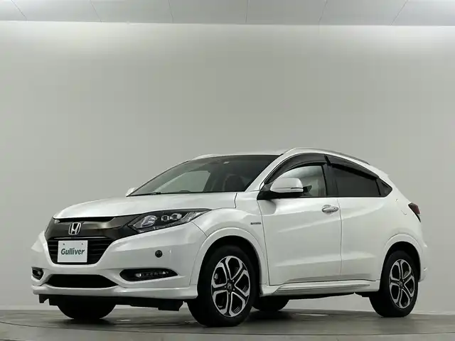 ホンダ ヴェゼル ハイブリッド Z ホンダセンシング 埼玉県 2016(平28)年 6.9万km ホワイトオーキッドパール 純正ナビ　温ヒーター　ＥＴＣ　Ｂカメラ　ＬＥＤヘッドライト　ハーフレザーシート　フルセグＴＶ　オートハイビーム　レーンキープ　衝突被害軽減　ＭＴモード付ＡＴ アダプティブクルーズコントロール