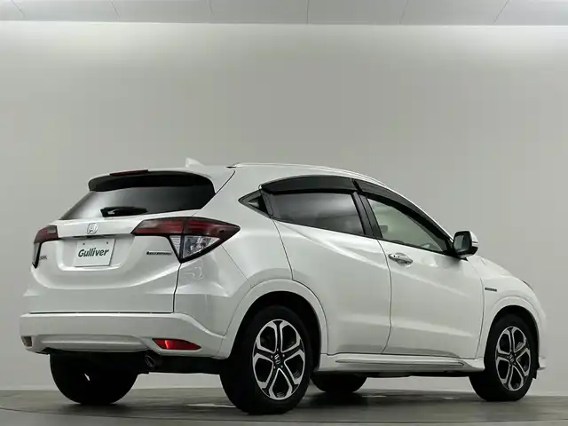 ホンダ ヴェゼル ハイブリッド Z ホンダセンシング 埼玉県 2016(平28)年 6.9万km ホワイトオーキッドパール 純正ナビ　温ヒーター　ＥＴＣ　Ｂカメラ　ＬＥＤヘッドライト　ハーフレザーシート　フルセグＴＶ　オートハイビーム　レーンキープ　衝突被害軽減　ＭＴモード付ＡＴ アダプティブクルーズコントロール