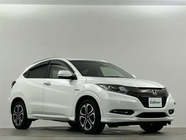 ホンダ ヴェゼル ハイブリッド Z ホンダセンシング 埼玉県 2016(平28)年 6.9万km ホワイトオーキッドパール 純正ナビ　温ヒーター　ＥＴＣ　Ｂカメラ　ＬＥＤヘッドライト　ハーフレザーシート　フルセグＴＶ　オートハイビーム　レーンキープ　衝突被害軽減　ＭＴモード付ＡＴ アダプティブクルーズコントロール