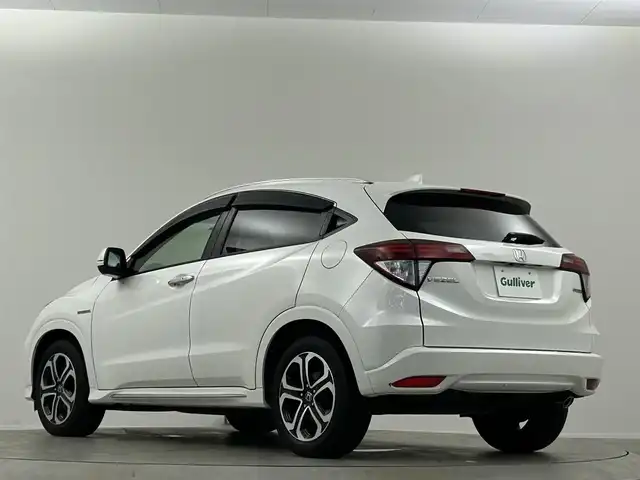 ホンダ ヴェゼル ハイブリッド Z ホンダセンシング 埼玉県 2016(平28)年 6.9万km ホワイトオーキッドパール 純正ナビ　温ヒーター　ＥＴＣ　Ｂカメラ　ＬＥＤヘッドライト　ハーフレザーシート　フルセグＴＶ　オートハイビーム　レーンキープ　衝突被害軽減　ＭＴモード付ＡＴ アダプティブクルーズコントロール
