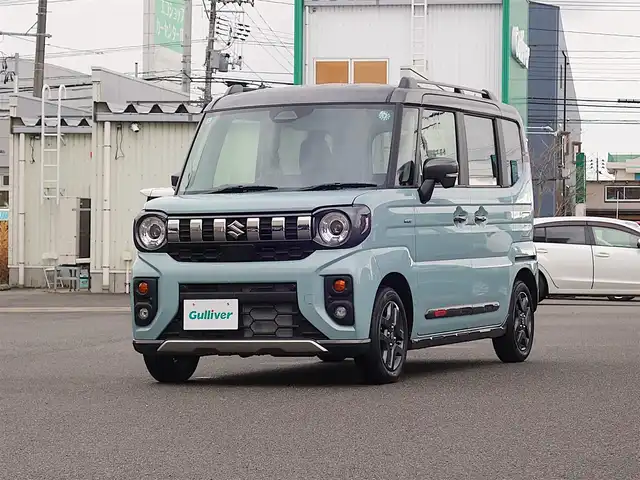 スズキ スペーシア ギア HYBRID XZ 山形県 2024(令6)年 0.1千km オフブルーメタリック/ガンメタリック2トーンルーフ 4WD/デュアルセンサーブレーキサポートII/両側パワースライドドア/レーダークルーズコントロール/LEDオートライト/シートヒーター/純正14インチアルミホイール/アイドリングストップ/コーナーセンサー/ステアリングスイッチ/ステアリングヒーター/ヘッドアップディスプレイ/電動格納ウィンカーミラー/フォグランプ/ルーフレール/スマートキー