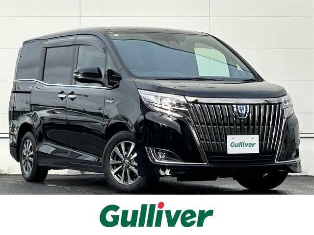 トヨタ エスクァイア ハイブリッド Gi プレミアムパッケージ ブラックテーラード 佐賀県 2019(令1)年 6.6万km ブラック トヨタセーフティセンス/・プリクラッシュセーフティ/・レーンディパーチャーアラート/・オートハイビーム/クルーズコントロール/クリアランスソナー/社外ナビ/・フルセグTV/BT/CD/DVD/・バックカメラ/フリップダウンモニター/純正15インチAW/両側パワースライドドア/LEDヘッドライト/オートライト/フォグランプ/ハーフレザーシート(合皮)/前席シートヒーター/前後ドライブレコーダー(DRV-MR740)/ETC/プッシュスタート/ウッドコンビ革巻きステアリング/ステアリングヒーター/ステアリングスイッチ/リアサンシェード/バックテーブル/電動格納ミラー/ドアバイザー/ISOFIX