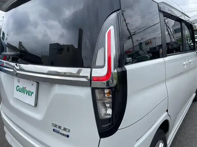 スズキ ソリオ HV MZ 山形県 2022(令4)年 4.4万km ピュアホワイトP 4WD/衝突軽減ブレーキ/両側パワースライドドア/全方位カメラ/純正10インチナビ/　【CD DVD SD USB BT】/フルセグTV/ETC/ステアリングスイッチ/レーダークルーズコントロール/アイドリングストップ/横滑り防止装置/シートヒーター/ミラーヒーター/純正アルミ/LEDライト/フォグランプ/ウィンカーミラー/純正フロアマット/ドアバイザー