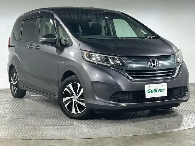 ホンダ フリード ハイブリット EX 神奈川県 2018(平30)年 7万km モダンスティールM 純正7型SDナビ/BT/フルセグ/CD/DVD/ETC/前後ドライブレコーダー/バックカメラ/前者追従クルーズコントロール/両側パワースライドドア/ステアリングリモコン/ハーフレザーシート/シートヒーター/ABS/横滑り防止装置