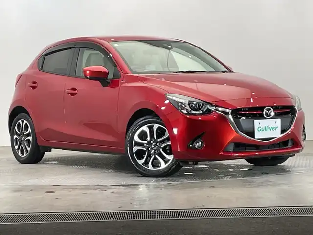 マツダ デミオ XD ツーリング Lパッケージ 栃木県 2015(平27)年 3.4万km ソウルレッドプレミアムメタリック ディーゼル/ターボ/純正ナビ/(CD/DVD/フルセグTV/Bluetooth/SD/USB)/バックカメラ/本革シート/衝突軽減ブレーキ/ETC/禁煙車/オートライト/LEDヘッドライト/パドルシフト/横滑り防止装置/フォグランプ/スマートキー/プッシュスタート/アイドリングストップ/ステアリングスイッチ/革巻きステアリング/ウィンカーミラー/電動格納ミラー/純正16インチアルミホイール/純正フロアマット