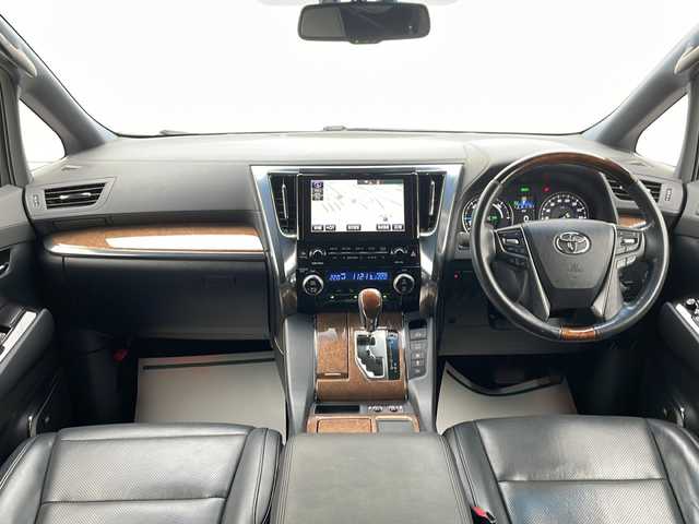 トヨタ アルファードハイブリット エグゼクティブ ラウンジ 山形県 2016(平28)年 6.4万km ラグジュアリーホワイトパールクリスタルシャインガラスフレーク 禁煙車/Toyota Safety Sense /・プリクラッシュセーフティ/・レーンディパーチャーアラート/・オートマチックハイビーム/・レーダークルーズコントロール/レザーシート/サンルーフ/JBLプレミアムサウンド/純正ナビ(CD.DVD.BT.USB.AUX)/パノラミックビューモニター/フルセグ/両側パワースライドドア/パワーバックドア/クリアランスソナー/シートヒーター/ステアリングヒーター/パワーシート/ETC/電動パーキングブレーキ/オートホールド/LEDヘッドライト/プッシュスタート/スマートキー