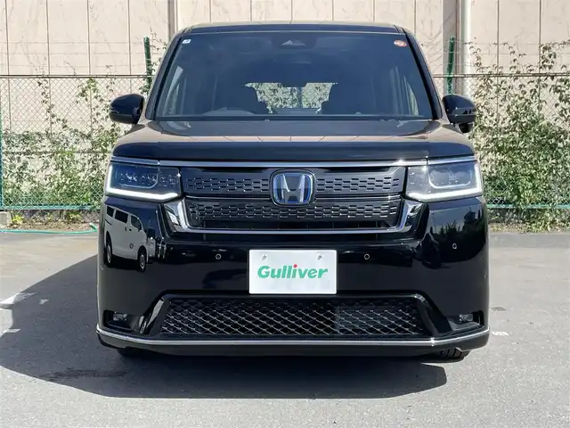 ホンダ ステップワゴン スパーダ eHEV 東京都 2025(令7)年 0.1千km クリスタルブラックパール 登録済み未使用車/純正ナビ　/・フルセグ　Bluetooth　CD　DVD/両側電動スライド　/電動リアゲート　/レーダークルーズコントロール　/ＢＳＩ　/テールゲートスポイラー　/シートヒーター　/純正アルミホイール　/純正ＬＥＤ　/オットマン　/パドルシフト　/ＡＢＳ　/横滑り防止/盗難防止装置/コーナーセンサー/レーンアシスト/衝突被害軽減ブレーキ