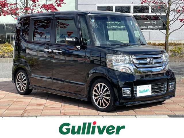 ホンダ Ｎ ＢＯＸ カスタム G ターボ Lパッケージ 福島県 2015(平27)年 7.6万km スマートブラック 純正ナビゲーション/型番：VXM-152VFi/【CD/DVD/SD/USB/BT/TV】/バックカメラ/ETC/両側電動スライドドア/前席シートヒーター/クルーズコントロール/パドルシフト/ステアリングリモコン/ドアハンドルプロテクター/HIDオートライト/シートバックテーブル/リアドアサンシェード/純正フロアマット/ドアバイザー