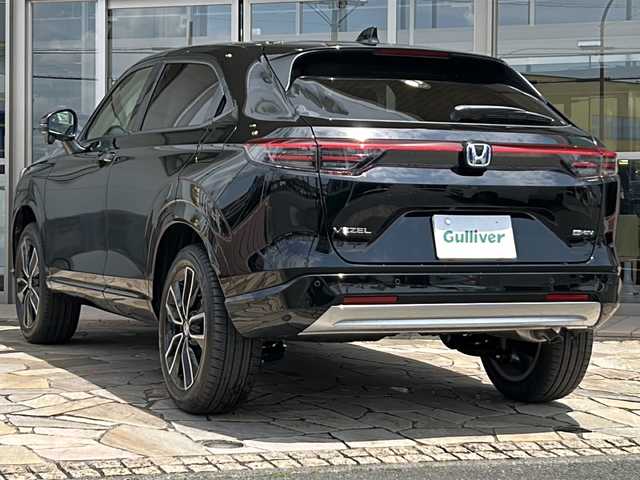 ホンダ ヴェゼル ハイブリッド e:HEV Z 静岡県 2025(令7)年 0.1万km未満 クリスタルブラックパール 【主要装備】/Ｈｏｎｄａ　ＣＯＮＮＥＣＴディスプレー/ＥＴＣ２．０車載器/ワイヤレス充電器　/メモリナビ/バックカメラ　/パワーバックドア　/プッシュスタート　/スマートキー　/純正１８インチアルミホイール　/レーダークルーズコントロール/前席シートヒーター/ハーフレザーシート/アップルカープレイ/アンドロイドオート/レーダークルーズコントロール/プリクラッシュセーフティ/クリアランスソナー