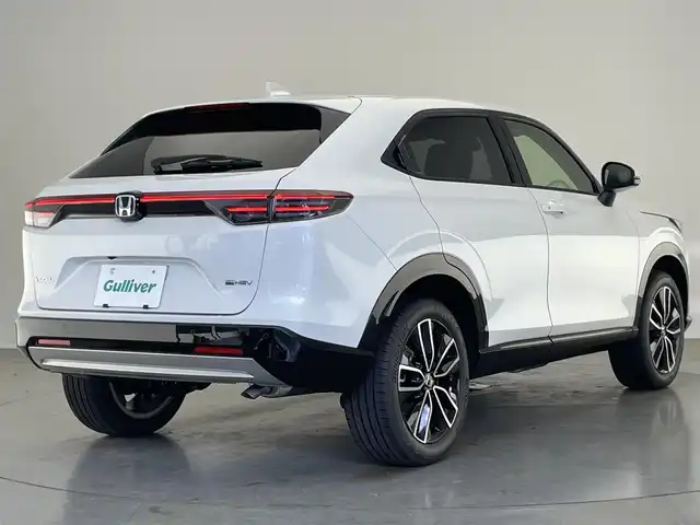 ホンダ ヴェゼル ハイブリッド e:HEV Z 愛知県 2025(令7)年 0.1千km プラチナホワイトパール 登録済未使用車　純正９型DA　BSM　追従クルコン　黒ハーフレザー　フルセグ　ETC２．０　ホンダセンシング　バックカメラ　パドルシフト　シートヒーター　ステアリングヒーター　ワイヤレス充電　禁煙車　コーナーセンサー　USB　LEDライト　フォグ　プッシュスタート　スマートキー