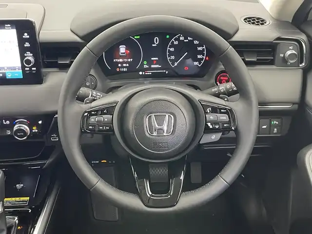 ホンダ ヴェゼル ハイブリッド e:HEV Z 愛知県 2025(令7)年 0.1千km プラチナホワイトパール 登録済未使用車　純正９型DA　BSM　追従クルコン　黒ハーフレザー　フルセグ　ETC２．０　ホンダセンシング　バックカメラ　パドルシフト　シートヒーター　ステアリングヒーター　ワイヤレス充電　禁煙車　コーナーセンサー　USB　LEDライト　フォグ　プッシュスタート　スマートキー