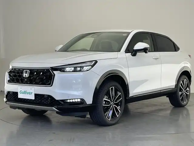 ホンダ ヴェゼル ハイブリッド e:HEV Z 愛知県 2025(令7)年 0.1千km プラチナホワイトパール 登録済未使用車　純正９型DA　BSM　追従クルコン　黒ハーフレザー　フルセグ　ETC２．０　ホンダセンシング　バックカメラ　パドルシフト　シートヒーター　ステアリングヒーター　ワイヤレス充電　禁煙車　コーナーセンサー　USB　LEDライト　フォグ　プッシュスタート　スマートキー