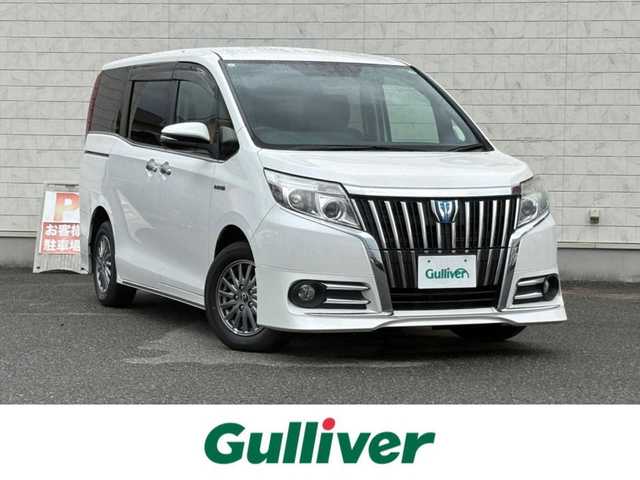 トヨタ エスクァイア ハイブリッド Gi 山口県 2015(平27)年 7.9万km ホワイトパールクリスタルシャイン 9型ナビ フルセグTV CD DVD BT/フリップダウンモニター/バックカメラ/両側パワースライドドア/ハーフレザーシート/前席シートヒーター/純正エアロ/クルーズコントロール/スマートキー/ドラレコ/おくだけ充電/DSRCビルトインETC/LEDオートヘッドライト/フォグライト/ステアリングリモコン/禁煙車