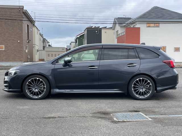 スバル レヴォーグ 1．6STIスポーツアイサイト 道央・札幌 2018(平30)年 7万km ダークグレーメタリック ４WD/純正メモリーナビ/AM/FM/BT/SD/CD/DVD/フルセグ/アイサイト/衝突被害軽減ブレーキ/横滑り防止装置/レーダークルーズコントロール/レーンキープアシスト/クリアランスソナー/ブラインドスポットモニター/バックカメラ/サイドカメラ/フロントカメラ/ビルトインETC/アイドリングストップ/前席パワーシート/D席メモリーシート/前席シートヒーター/レザーシート/革巻きステアリング/ステアリングリモコン/パドルシフト/ガラスルーフ/オートブレーキホールド/デジタルインナーミラー/MTモード付AT/プッシュスタート/スマートキー/LEDヘッドライト/オートライト/フォグランプ/電動格納ミラー/ヒーテッドドアミラー/ウィンカーミラー/純正フロアマット/ドアバイザー/スペアキー