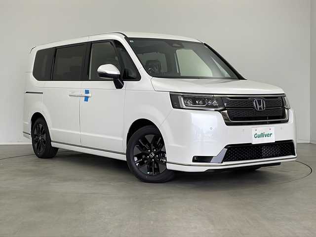 ホンダ ステップワゴン スパーダ eHEV 新潟県 2025(令7)年 0.1万km未満 プラチナムホワイトパール 純正11.4インチナビ CD・DVD・Bluetooth/電動パワースライドドア/ホンダコネクト/両側シートヒーター/オートハイビーム/パドルシフト/後席オットマン/後席エアコン/USB端子/電動バックドア