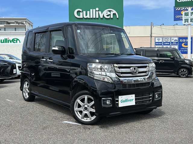 ホンダ Ｎ ＢＯＸ カスタム G ターボ Lパッケージ 石川県 2015(平27)年 8.1万km スマートブラック 4WD / ターボ/純正8インチナビゲーション/（型番：VXM-155VFEi）/【CD/DVD/SD/BT/TV】/バックカメラ/フリップダウンモニター/クルーズコントロール/本革巻ステアリング/パドルシフト/ステアリングスイッチ/両側パワースライドドア/前席シートヒーター/シートバックテーブル/リアドアサンシェード/リアドアイージークローザー/ドアバイザー/オートリトラミラー/HIDオートライト/VSA（ABS＋TCS＋横すべり抑制）/プッシュスタート/アイドリングストップ