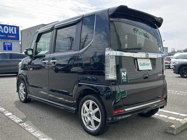 ホンダ Ｎ ＢＯＸ カスタム G ターボ Lパッケージ 石川県 2015(平27)年 8.1万km スマートブラック 4WD / ターボ/純正8インチナビゲーション/（型番：VXM-155VFEi）/【CD/DVD/SD/BT/TV】/バックカメラ/フリップダウンモニター/クルーズコントロール/本革巻ステアリング/パドルシフト/ステアリングスイッチ/両側パワースライドドア/前席シートヒーター/シートバックテーブル/リアドアサンシェード/リアドアイージークローザー/ドアバイザー/オートリトラミラー/HIDオートライト/VSA（ABS＋TCS＋横すべり抑制）/プッシュスタート/アイドリングストップ