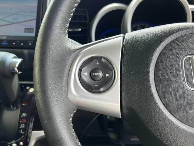 ホンダ Ｎ ＢＯＸ カスタム G ターボ Lパッケージ 石川県 2015(平27)年 8.1万km スマートブラック 4WD / ターボ/純正8インチナビゲーション/（型番：VXM-155VFEi）/【CD/DVD/SD/BT/TV】/バックカメラ/フリップダウンモニター/クルーズコントロール/本革巻ステアリング/パドルシフト/ステアリングスイッチ/両側パワースライドドア/前席シートヒーター/シートバックテーブル/リアドアサンシェード/リアドアイージークローザー/ドアバイザー/オートリトラミラー/HIDオートライト/VSA（ABS＋TCS＋横すべり抑制）/プッシュスタート/アイドリングストップ