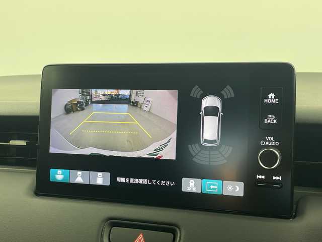 ホンダ ヴェゼル ハイブリッド e:HEV Z 愛知県 2025(令7)年 0.1千km パール 登録済未使用車　5km/ホンダコネクトディスプレイ/・ナビゲーション機能/・フルセグテレビ/・Bluetooth/バックカメラ/ETC2.0/ワイヤレス充電器/ステアリングスイッチ/ベルリナブラックフロントグリル/ハンズフリーアクセスパワーテールゲート/LEDシーケンシャルターンシグナルランプ/ブラインドスポットインフォメーション/後退出庫サポート/ホンダセンシング/・衝突軽減ブレーキ/・先行車発信お知らせ機能/・歩行者事故低減システム/・路外逸脱抑制機能/・標識認識機能/・渋滞追従機能アダプティブクルーズコントロール/・車線維持支援システム/・トラフィックジャムアシスト/・誤発信誤後退抑制機能/・アダプティブドライビングビーム/・近距離衝突軽減ブレーキ/・急アクセル抑制機能/ステアリングヒーター/シートヒーター/ドライブモードセレクター