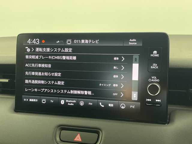 ホンダ ヴェゼル ハイブリッド e:HEV Z 愛知県 2025(令7)年 0.1千km パール 登録済未使用車　5km/ホンダコネクトディスプレイ/・ナビゲーション機能/・フルセグテレビ/・Bluetooth/バックカメラ/ETC2.0/ワイヤレス充電器/ステアリングスイッチ/ベルリナブラックフロントグリル/ハンズフリーアクセスパワーテールゲート/LEDシーケンシャルターンシグナルランプ/ブラインドスポットインフォメーション/後退出庫サポート/ホンダセンシング/・衝突軽減ブレーキ/・先行車発信お知らせ機能/・歩行者事故低減システム/・路外逸脱抑制機能/・標識認識機能/・渋滞追従機能アダプティブクルーズコントロール/・車線維持支援システム/・トラフィックジャムアシスト/・誤発信誤後退抑制機能/・アダプティブドライビングビーム/・近距離衝突軽減ブレーキ/・急アクセル抑制機能/ステアリングヒーター/シートヒーター/ドライブモードセレクター