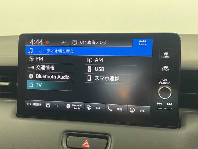 ホンダ ヴェゼル ハイブリッド e:HEV Z 愛知県 2025(令7)年 0.1千km パール 登録済未使用車　5km/ホンダコネクトディスプレイ/・ナビゲーション機能/・フルセグテレビ/・Bluetooth/バックカメラ/ETC2.0/ワイヤレス充電器/ステアリングスイッチ/ベルリナブラックフロントグリル/ハンズフリーアクセスパワーテールゲート/LEDシーケンシャルターンシグナルランプ/ブラインドスポットインフォメーション/後退出庫サポート/ホンダセンシング/・衝突軽減ブレーキ/・先行車発信お知らせ機能/・歩行者事故低減システム/・路外逸脱抑制機能/・標識認識機能/・渋滞追従機能アダプティブクルーズコントロール/・車線維持支援システム/・トラフィックジャムアシスト/・誤発信誤後退抑制機能/・アダプティブドライビングビーム/・近距離衝突軽減ブレーキ/・急アクセル抑制機能/ステアリングヒーター/シートヒーター/ドライブモードセレクター