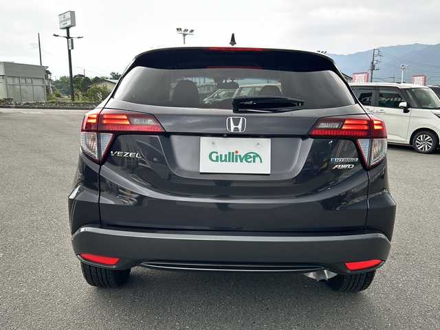 ホンダ ヴェゼル ハイブリッド X 山梨県 2015(平27)年 5.5万km ルーセブラックM 4WD/純正ナビ/フルセグテレビ/Bluetooth接続/メモリナビ/バックカメラ/ETC/ドライブレコーダー/MTモード付AT/クルーズコントロール/パワーウィンドウ/スマートキー/純正フロアマット/純正アルミホイール/ABS/横滑り防止/オートライト/LEDライト