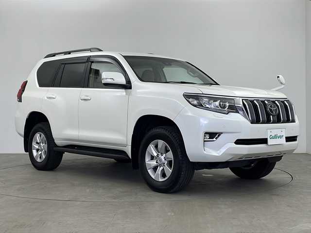 トヨタ ランドクルーザー プラド TX Lパッケージ 鹿児島県 2023(令5)年 1.1万km ホワイトパールクリスタルシャイン 純正ナビ/（CD/DVD/BT/フルセグTV）/サンルーフ/レーダークルーズコントロール/プリクラッシュセーフティ/レーンキープアシスト/パワーシート/ベージュ革シート/シートヒーター/シートベンチレーション/オートライト/オートマチックハイビーム/バックカメラ/ETC2.0