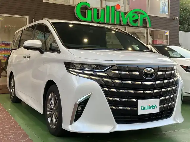 トヨタ アルファードハイブリット Z 神奈川県 2024(令6)年 2.3万km プラチナホワイトパールマイカ ワンオーナー/新車保証書/取扱説明書/レザーシート/パワーシート/シートヒーター/14インチディスプレイオーディオ/ナビ・フルセグTV/Bluetooth/USB入力/HDMI入力/AppleCarPlay/AndroidAuto/ETC2.0/ブラインドスポットモニター/左右独立ムーンルーフ/デジタルインナーミラー/セーフティセンス/・プリクラッシュセーフティ/・レーントレーシングアシスト/・レーンディパーチャーアラート/・全車速追従機能付レーダークルーズコントロール/・アダプティブハイビームアシスト/・ロードサインアシスト/・ドライバー異常時対応システム/・プロアクティブドライビングアシスト/・発進遅れ告知機能/両側パワースライドドア/パワーバックドア/三眼LEDヘッドライト