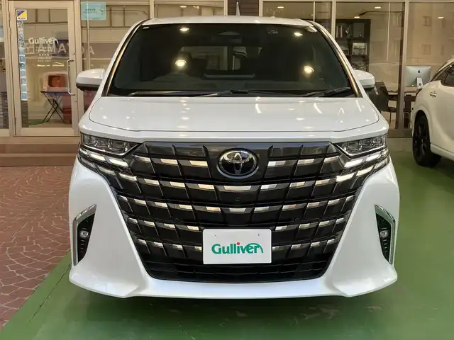 トヨタ アルファードハイブリット Z 神奈川県 2024(令6)年 2.3万km プラチナホワイトパールマイカ ワンオーナー/新車保証書/取扱説明書/レザーシート/パワーシート/シートヒーター/14インチディスプレイオーディオ/ナビ・フルセグTV/Bluetooth/USB入力/HDMI入力/AppleCarPlay/AndroidAuto/ETC2.0/ブラインドスポットモニター/左右独立ムーンルーフ/デジタルインナーミラー/セーフティセンス/・プリクラッシュセーフティ/・レーントレーシングアシスト/・レーンディパーチャーアラート/・全車速追従機能付レーダークルーズコントロール/・アダプティブハイビームアシスト/・ロードサインアシスト/・ドライバー異常時対応システム/・プロアクティブドライビングアシスト/・発進遅れ告知機能/両側パワースライドドア/パワーバックドア/三眼LEDヘッドライト